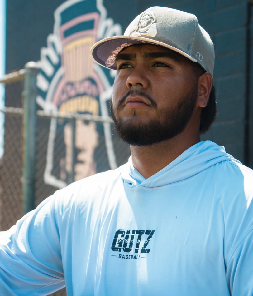 Coach Jacob Gutierrez in a Gutz Baseball hoodie