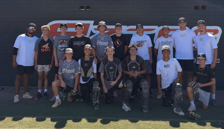 Coach Gutz with a group of players after a clinic